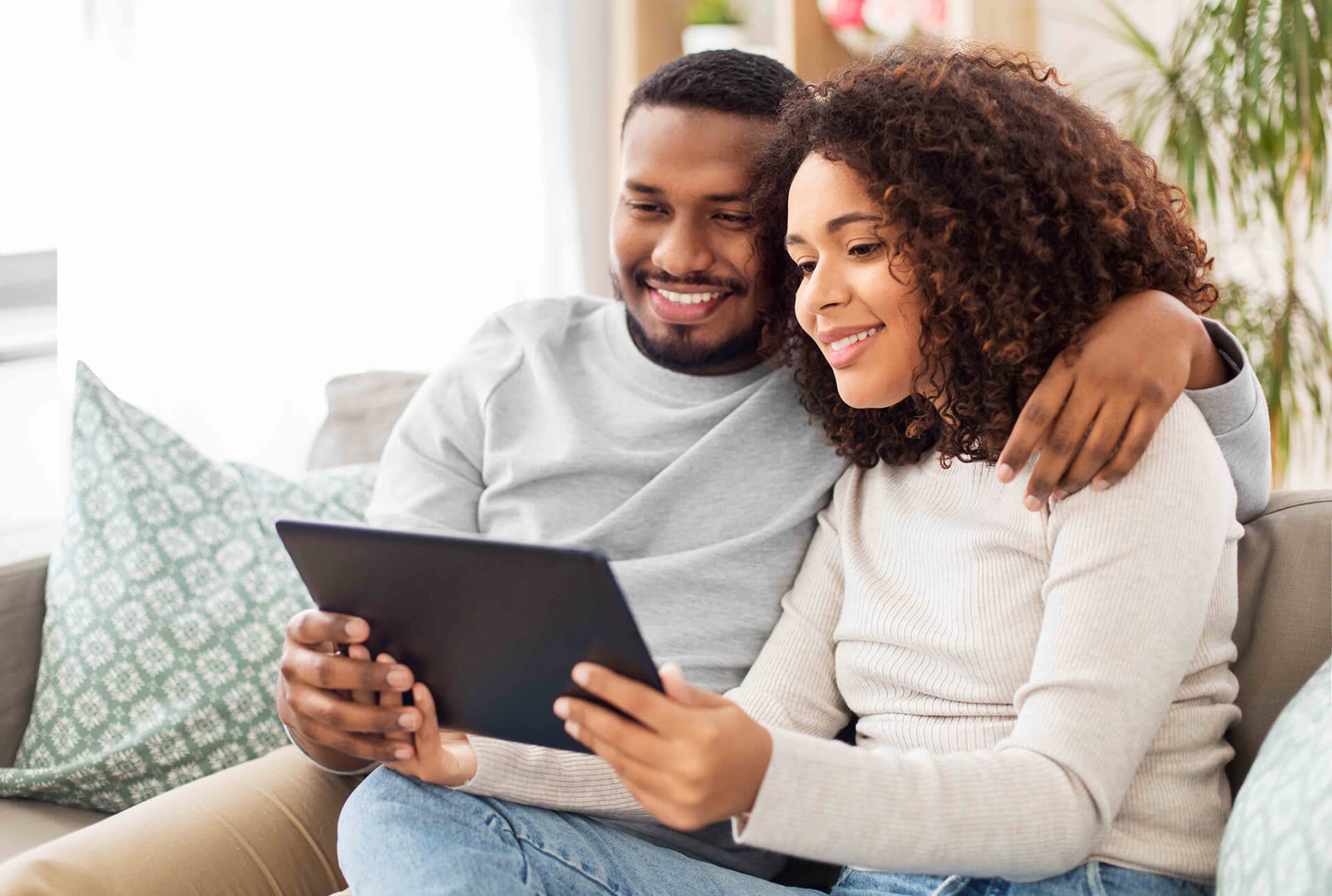 Couple looking at tablet