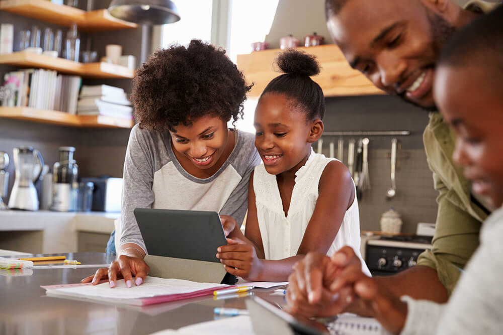 children learning doing homework with parents